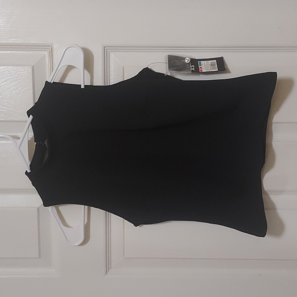 Black sleeveless blouse with back cutout